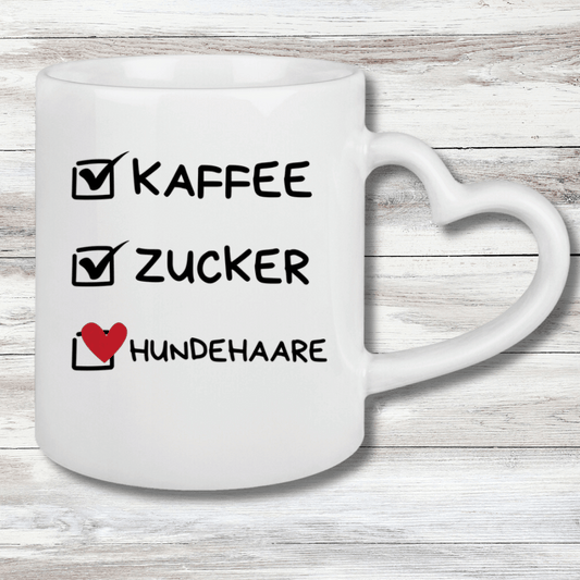 Tasse mit Herzhenkel Kaffee, Zucker, Hundehaare